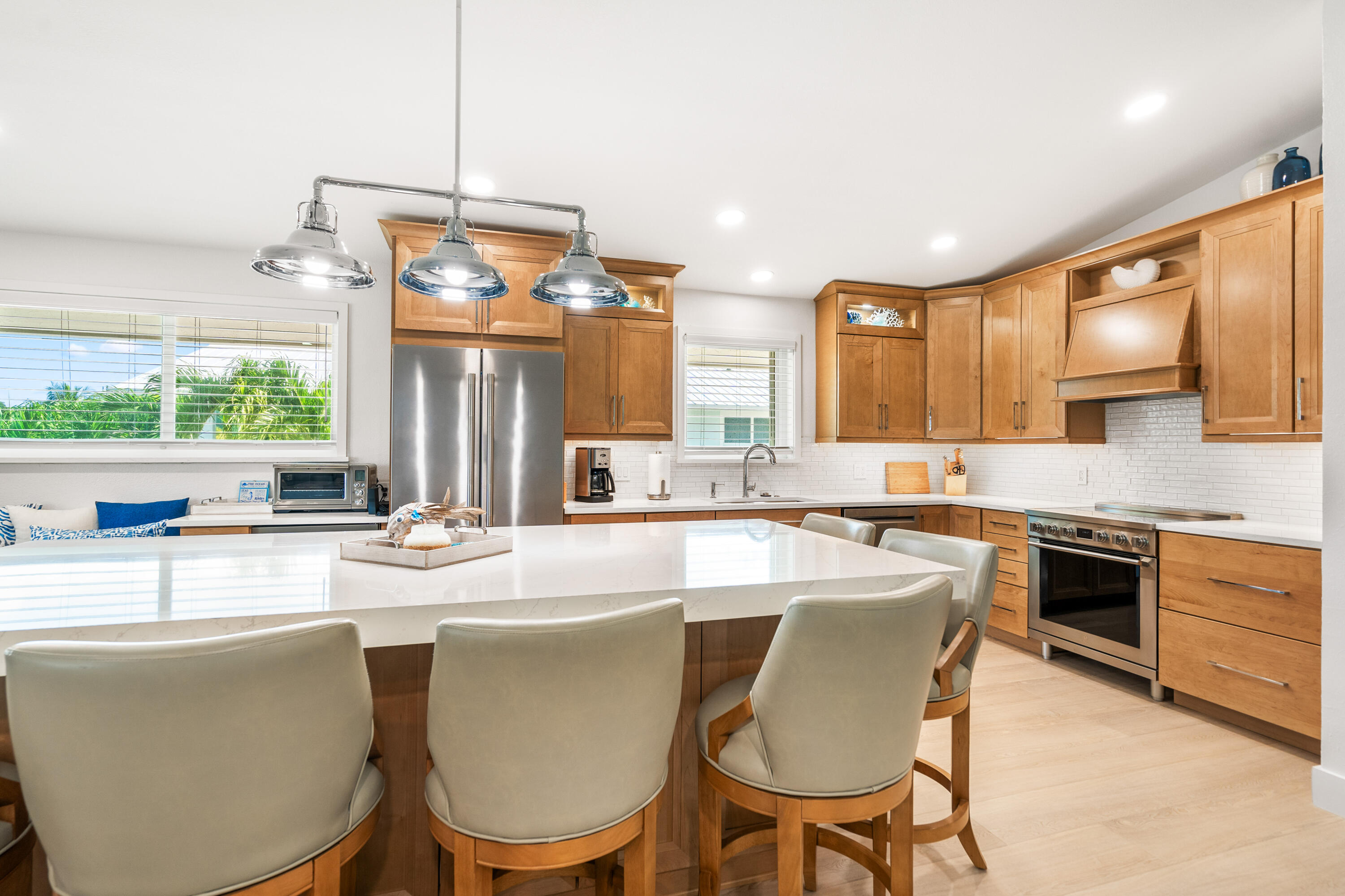 114 Spoonbill Road Tavernier, FL 33070 - Photo 5 of 43 a kitchen with a dining table chairs stove and white cabinets