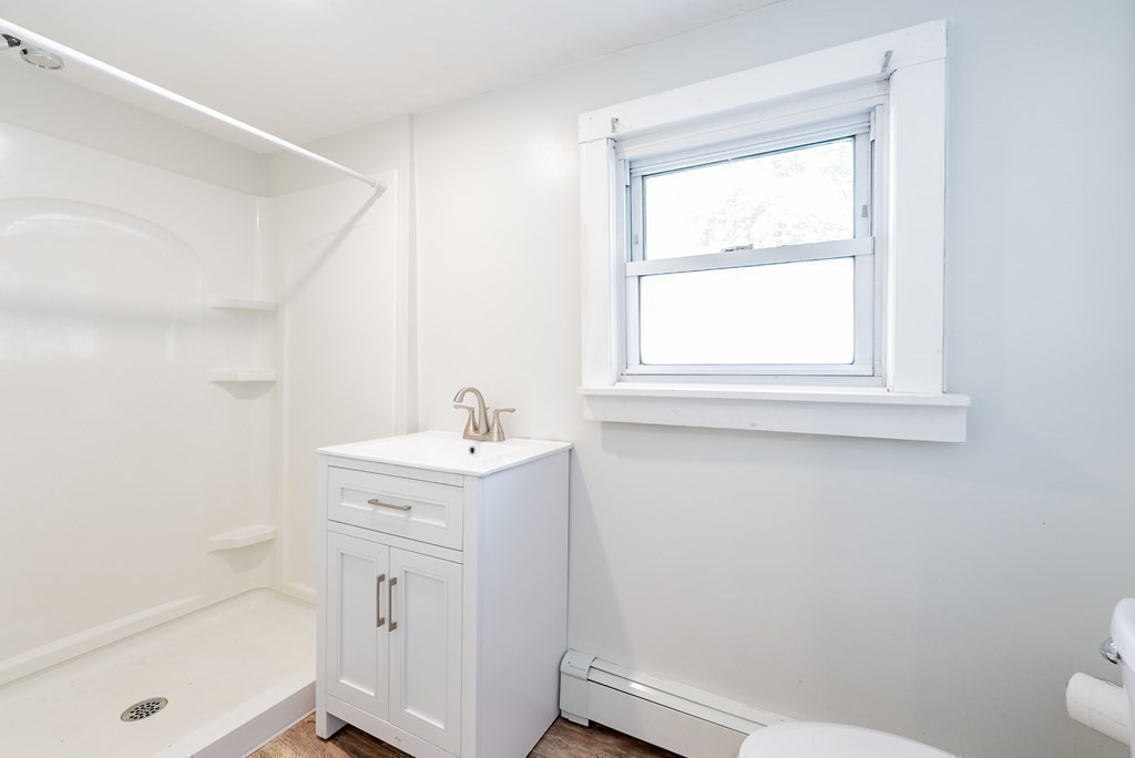 272 Denver Street Springfield, MA 01109 - Photo 12 of 32 a bathroom with a sink a toilet and a bathtub