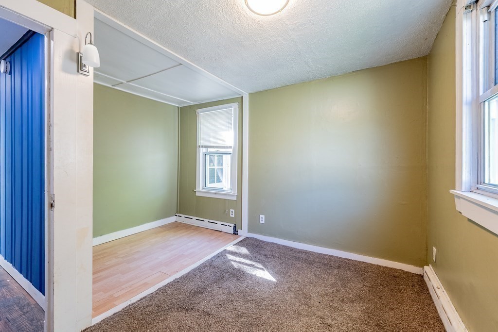 272 Denver Street Springfield, MA 01109 - Photo 17 of 32 an empty room with windows