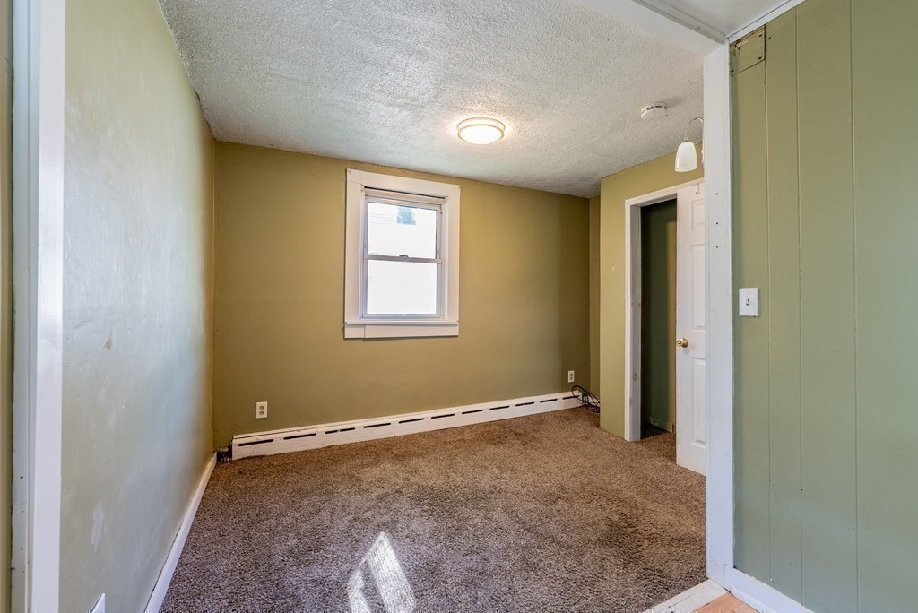 272 Denver Street Springfield, MA 01109 - Photo 19 of 32 a view of an empty room with a window