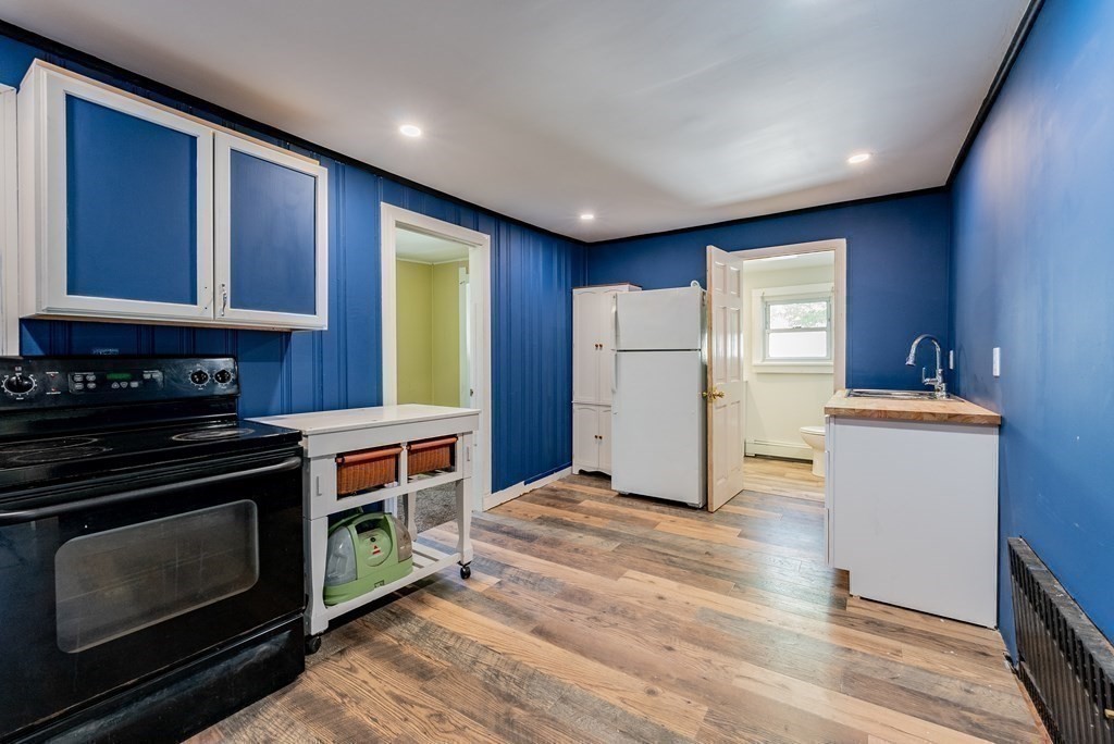 272 Denver Street Springfield, MA 01109 - Photo 21 of 32 a kitchen with refrigerator and window