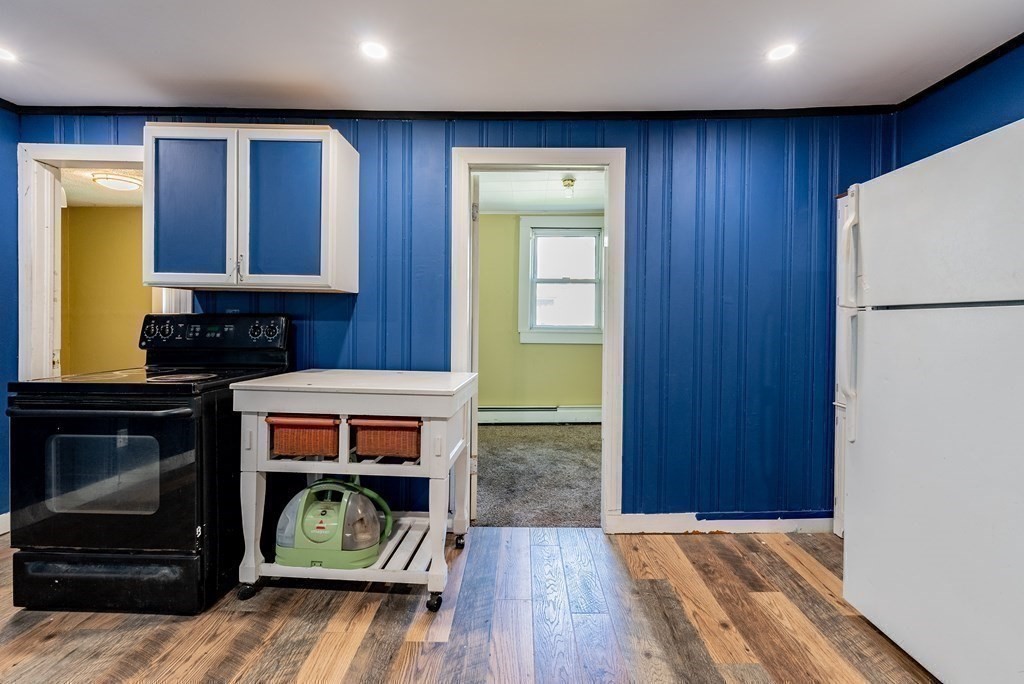 272 Denver Street Springfield, MA 01109 - Photo 24 of 32 a area with wooden floor and brick walls