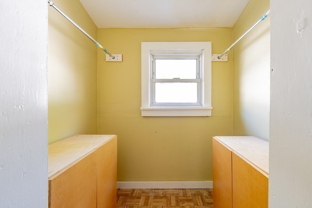 272 Denver Street Springfield, MA 01109 - Photo 28 of 32 a bathroom with a sink a window and a shower