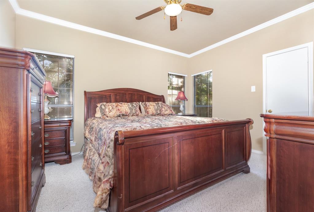 5859 Frankford Road, Unit 802 Dallas, TX 75252 - Photo 18 of 33 a bedroom with a bed and a chandelier