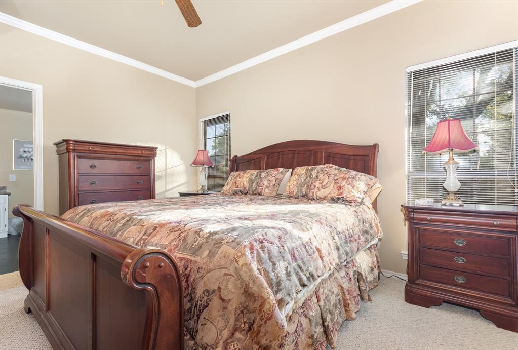 5859 Frankford Road, Unit 802 Dallas, TX 75252 - Photo 19 of 33 a bedroom with a bed and a dresser