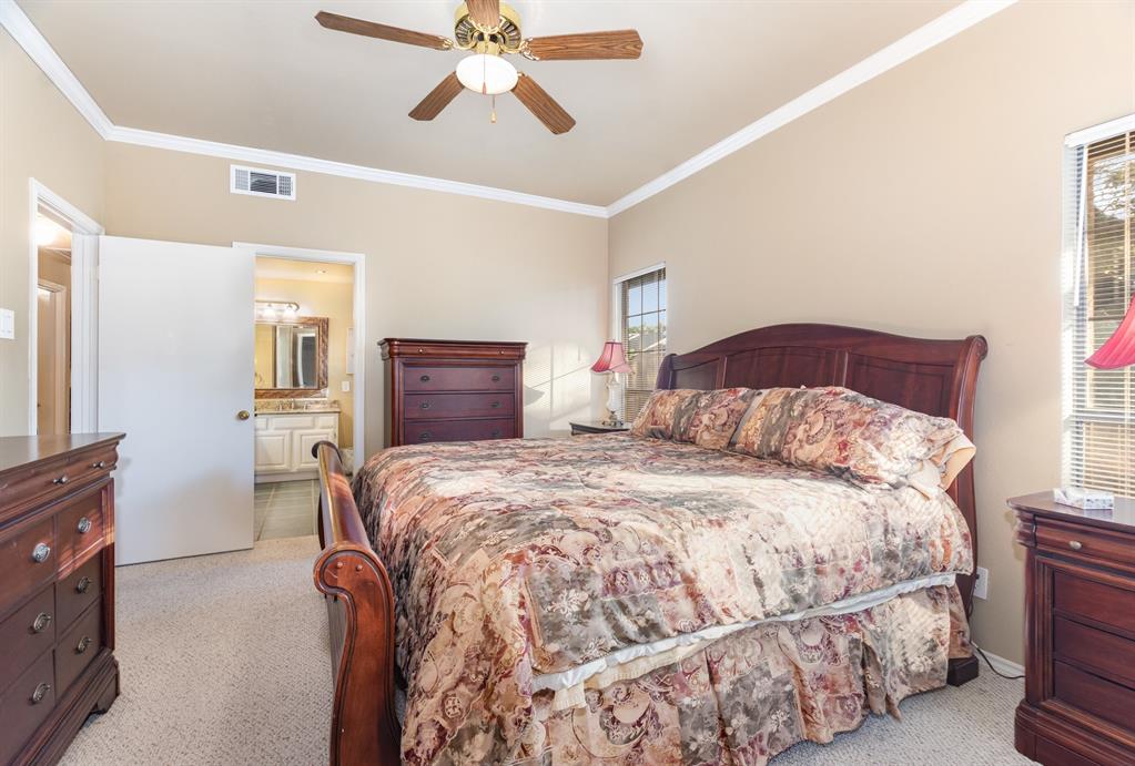 5859 Frankford Road, Unit 802 Dallas, TX 75252 - Photo 20 of 33 a bedroom with a bed and wooden floor