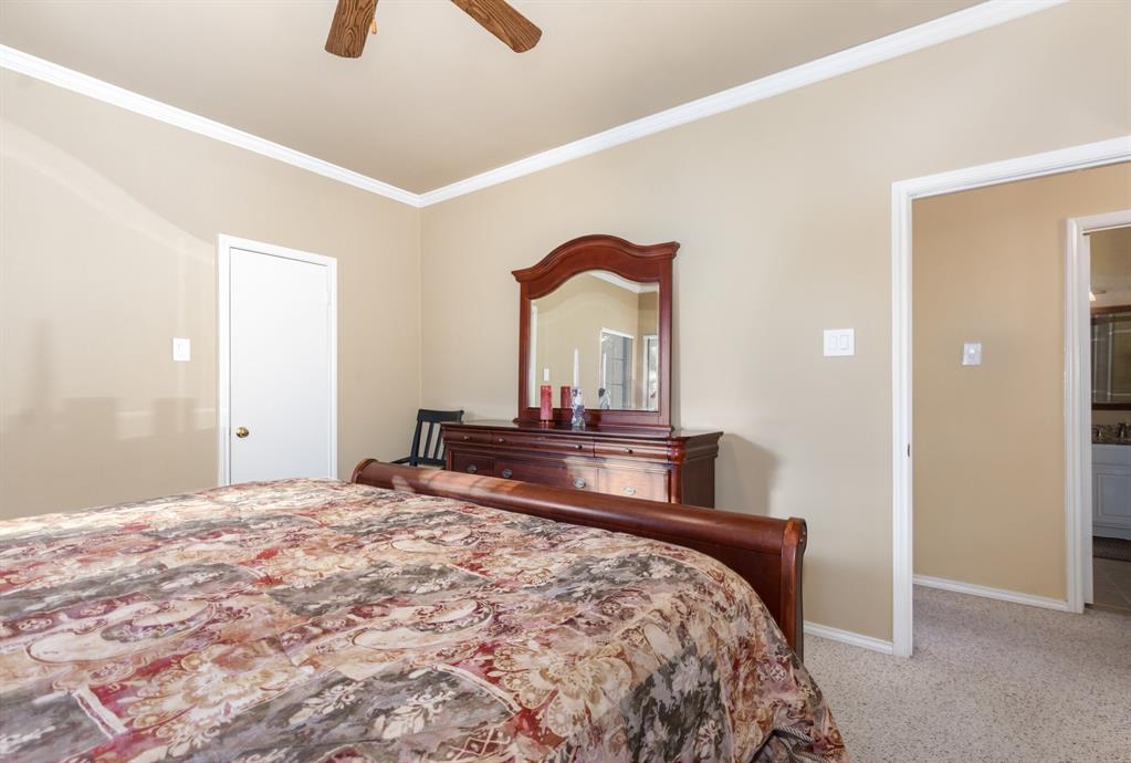 5859 Frankford Road, Unit 802 Dallas, TX 75252 - Photo 22 of 33 a bedroom with a bed and a dresser
