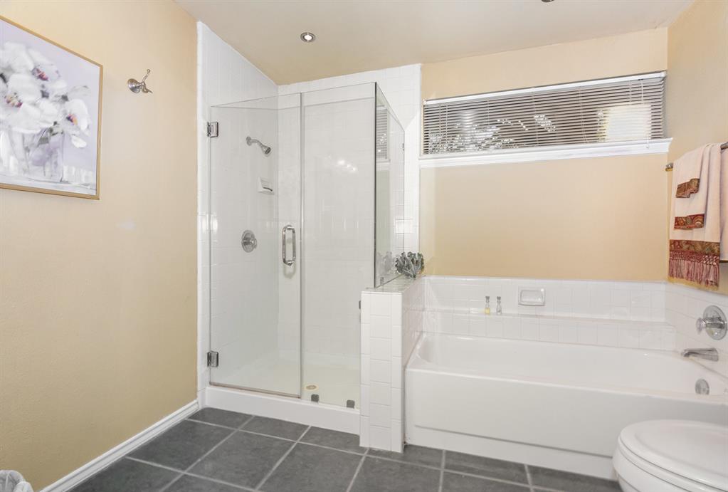 5859 Frankford Road, Unit 802 Dallas, TX 75252 - Photo 23 of 33 a bathroom with a bathtub and a shower