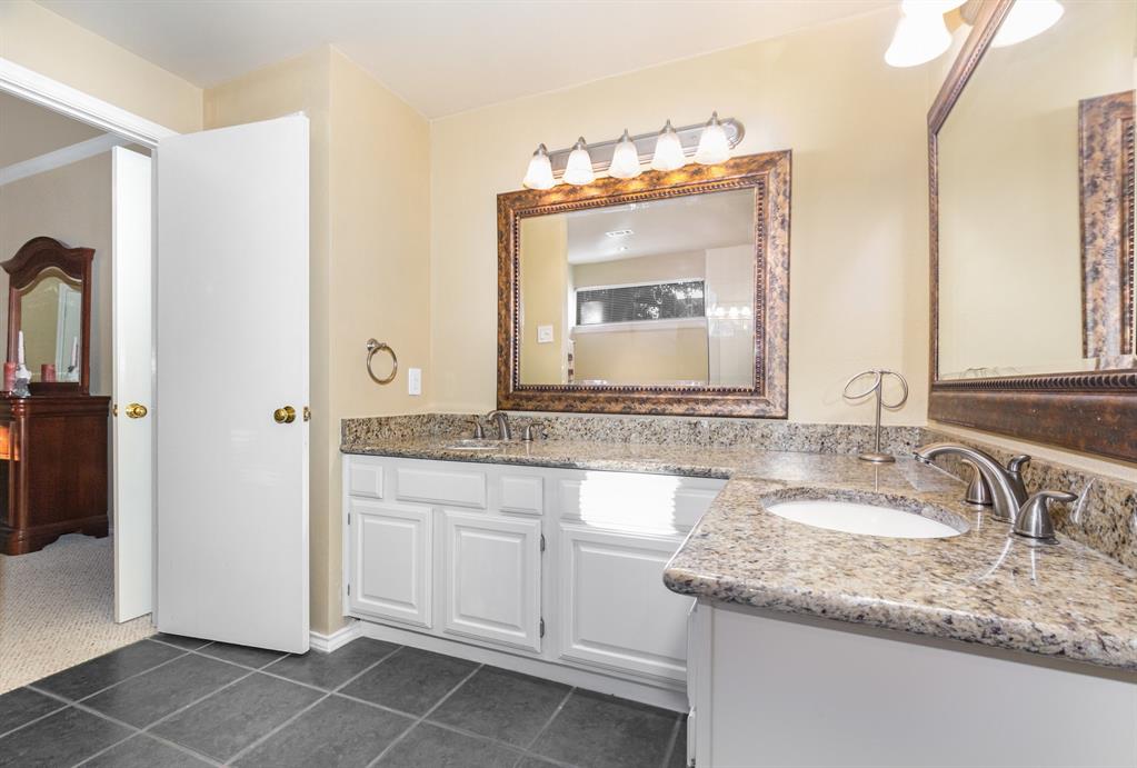 5859 Frankford Road, Unit 802 Dallas, TX 75252 - Photo 24 of 33 a bathroom with a granite countertop sink and a mirror