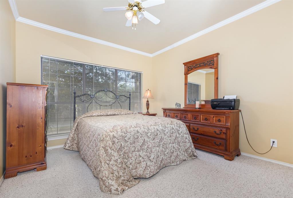 5859 Frankford Road, Unit 802 Dallas, TX 75252 - Photo 25 of 33 a bedroom with a bed and a dresser