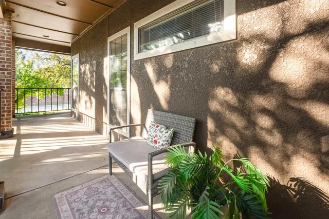 a living room with patio furniture