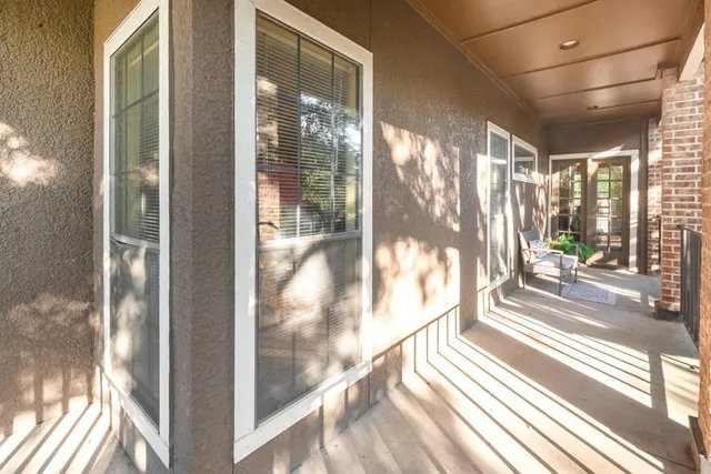 a view of a city from a glass door