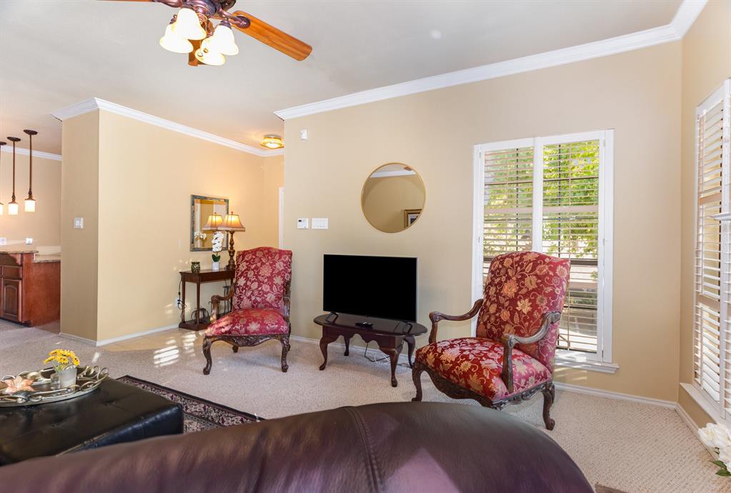 5859 Frankford Road, Unit 802 Dallas, TX 75252 - Photo 6 of 33 a living room with furniture a flat screen tv and a large window