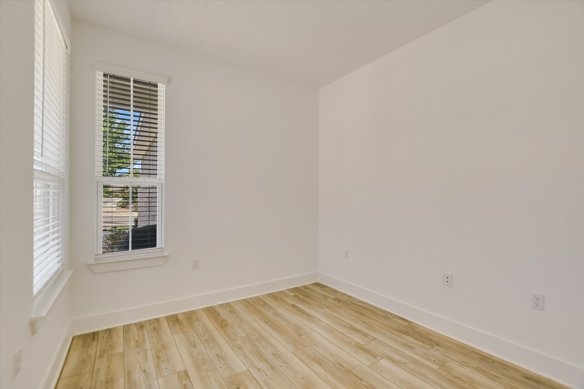 702 Kitty Hawk Road Georgetown, TX 78633 - Photo 11 of 21 a view of a room that has wooden floor and a window
