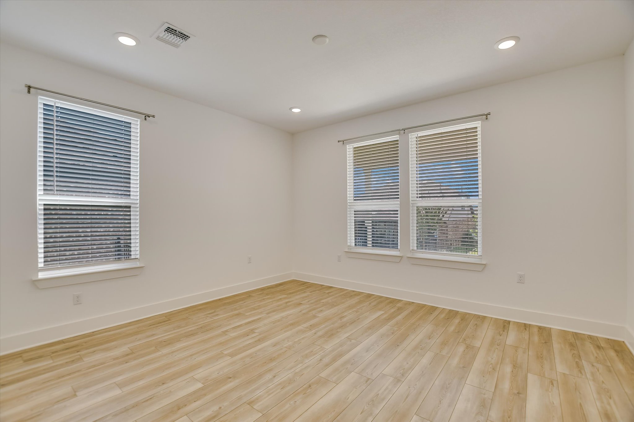 702 Kitty Hawk Road Georgetown, TX 78633 - Photo 12 of 21 a view of an empty room with wooden floor and a window