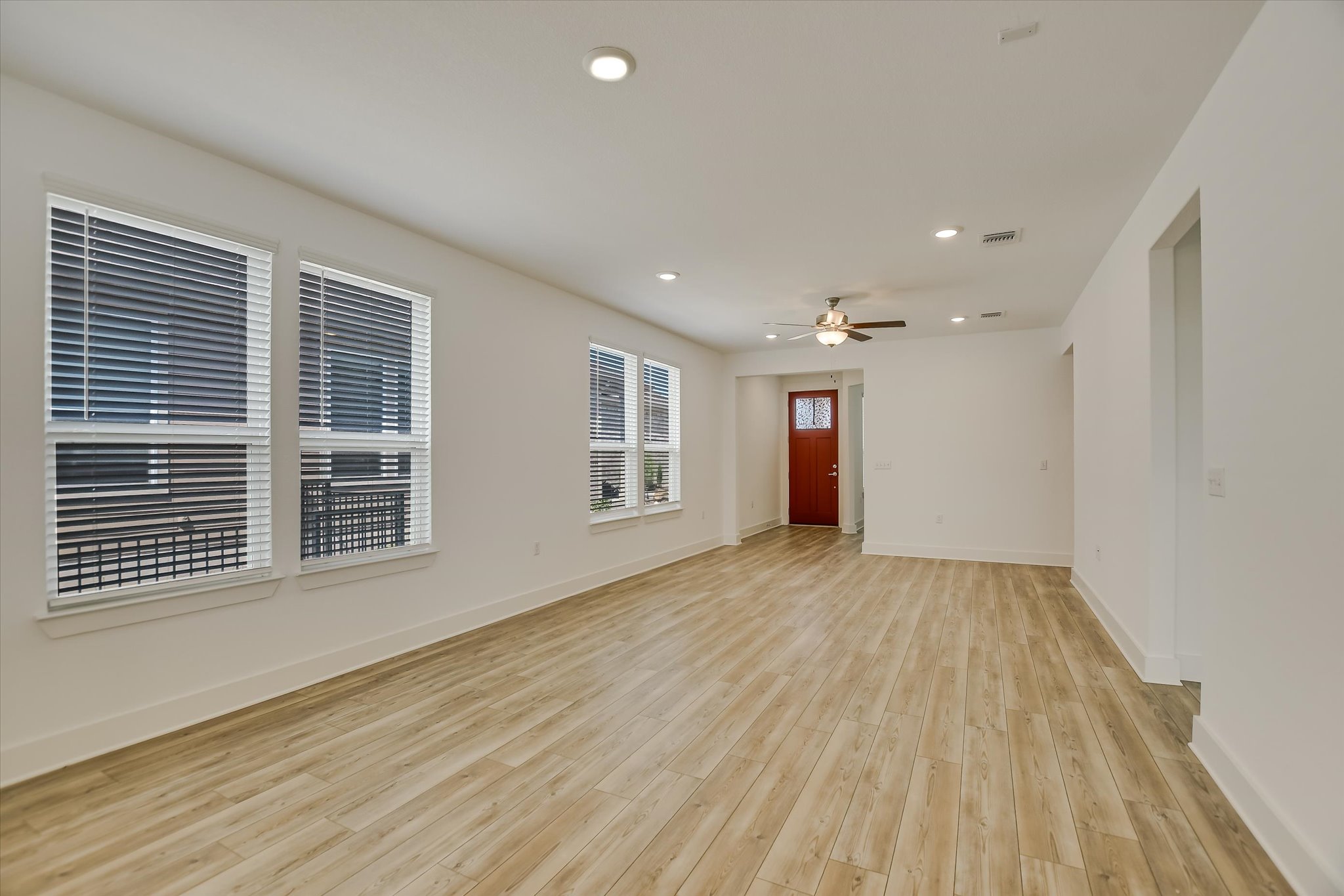 702 Kitty Hawk Road Georgetown, TX 78633 - Photo 6 of 21 a view of an empty room with wooden floor and a window