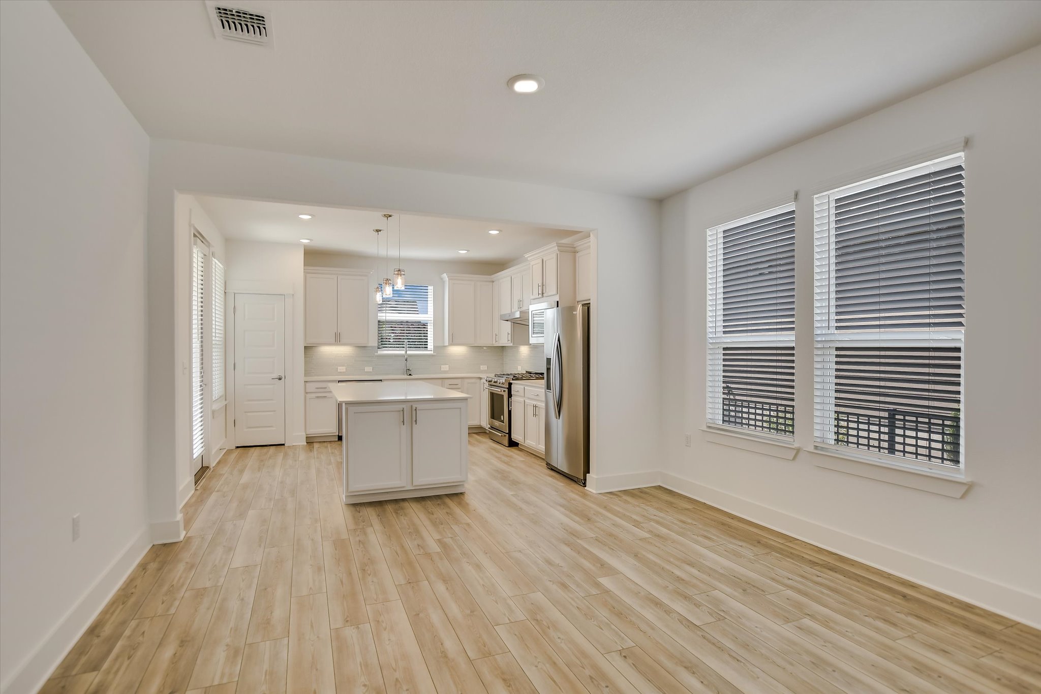 702 Kitty Hawk Road Georgetown, TX 78633 - Photo 7 of 21 a view of kitchen with wooden floor and electronic appliances