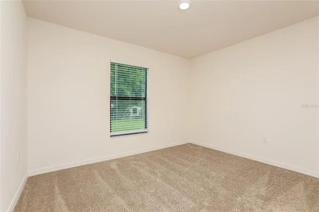 a view of a room that has a window in it