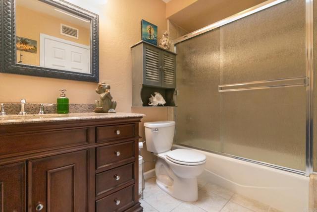 23452 Barona Mesa Road Ramona, CA 92065 - Photo 13 of 27 a bathroom with a toilet sink and shower