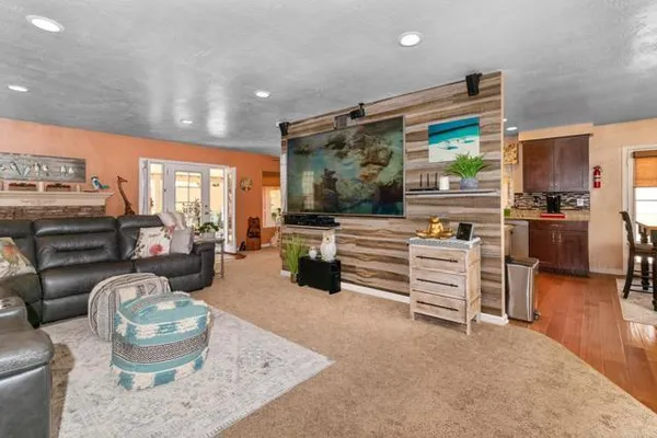 a room with furniture and a flat screen tv