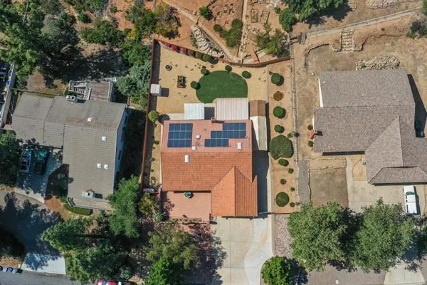 an aerial view of residential houses with outdoor space