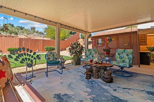 23452 Barona Mesa Road Ramona, CA 92065 - Photo 7 of 27 a living room with patio furniture and a potted plant