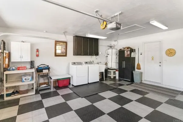 a storage & utility room with a sink