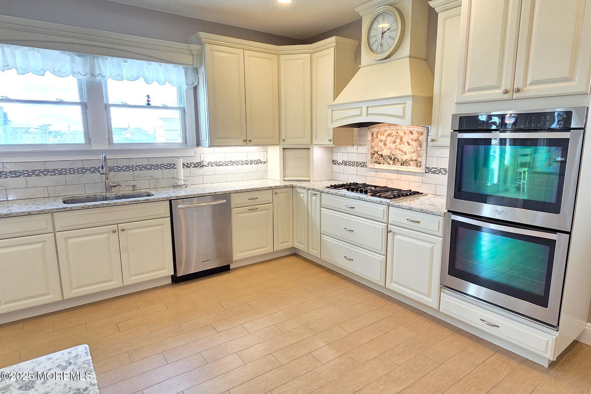417 Delray Drive Lavallette, NJ 08735 - Photo 14 of 71 a kitchen with a sink stove and cabinets