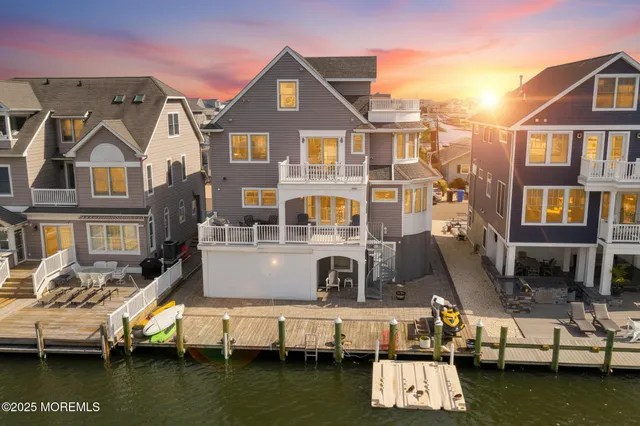 an aerial view of a house with a ocean view