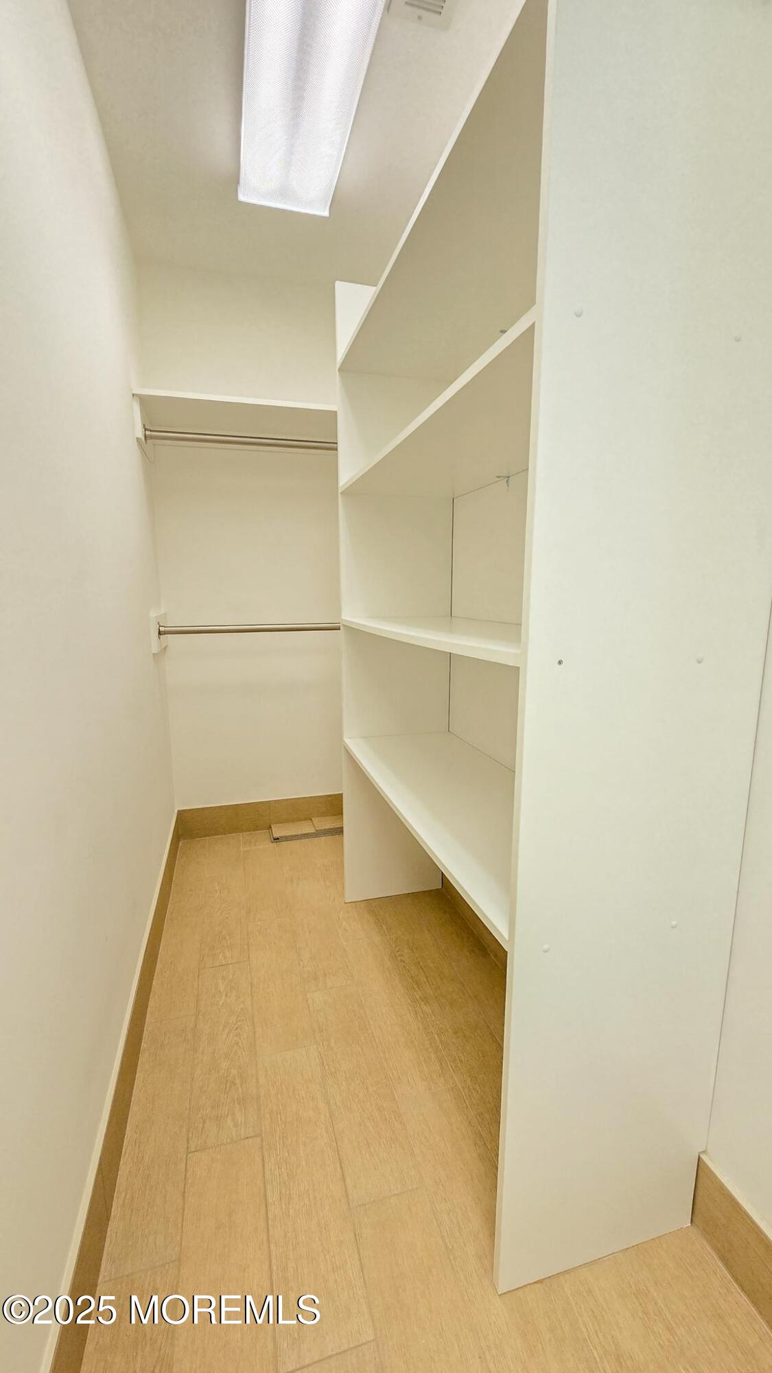 417 Delray Drive Lavallette, NJ 08735 - Photo 21 of 71 a view of an empty room with empty racks