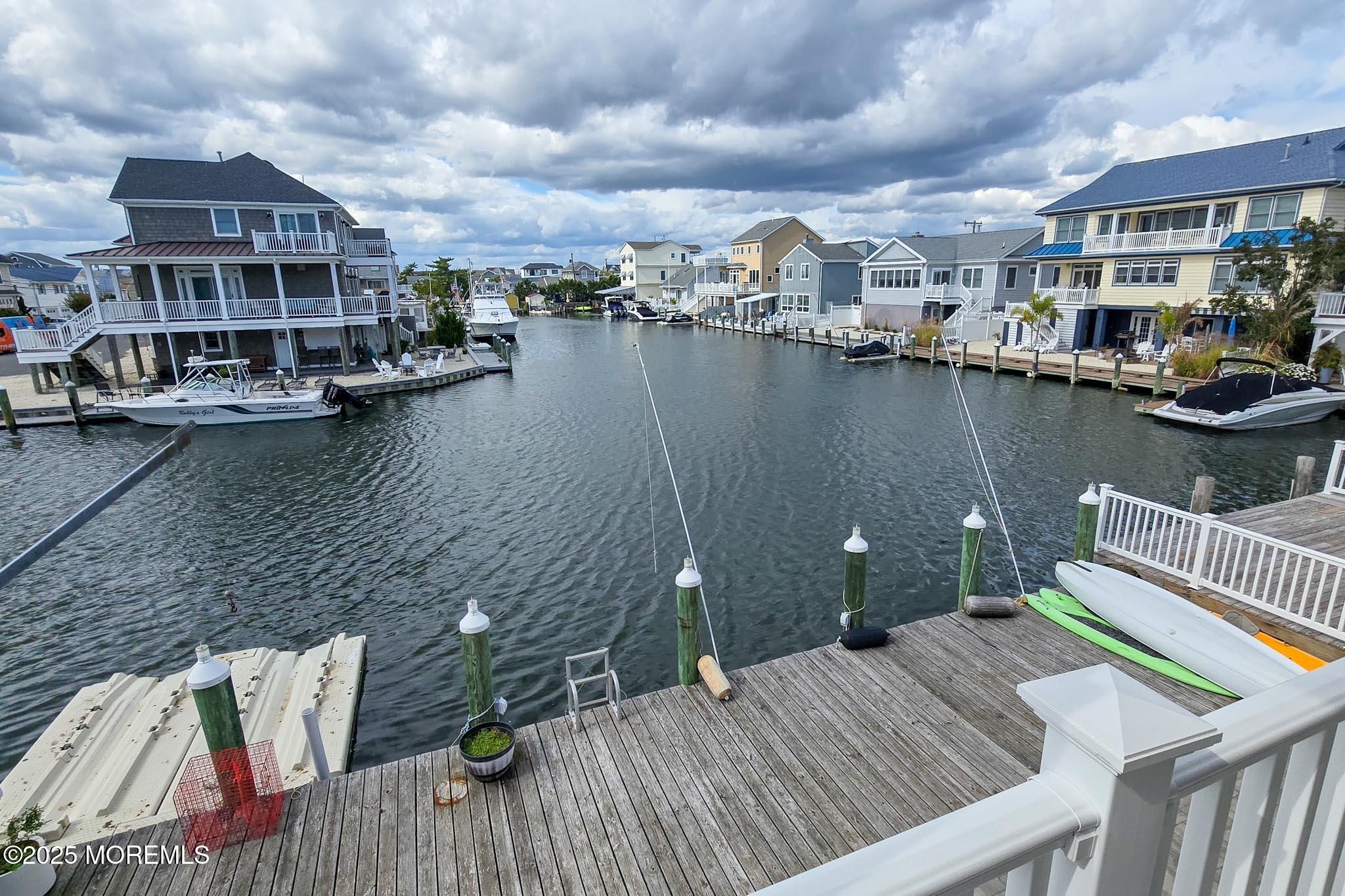 417 Delray Drive Lavallette, NJ 08735 - Photo 22 of 71 a view of a lake with tall buildings
