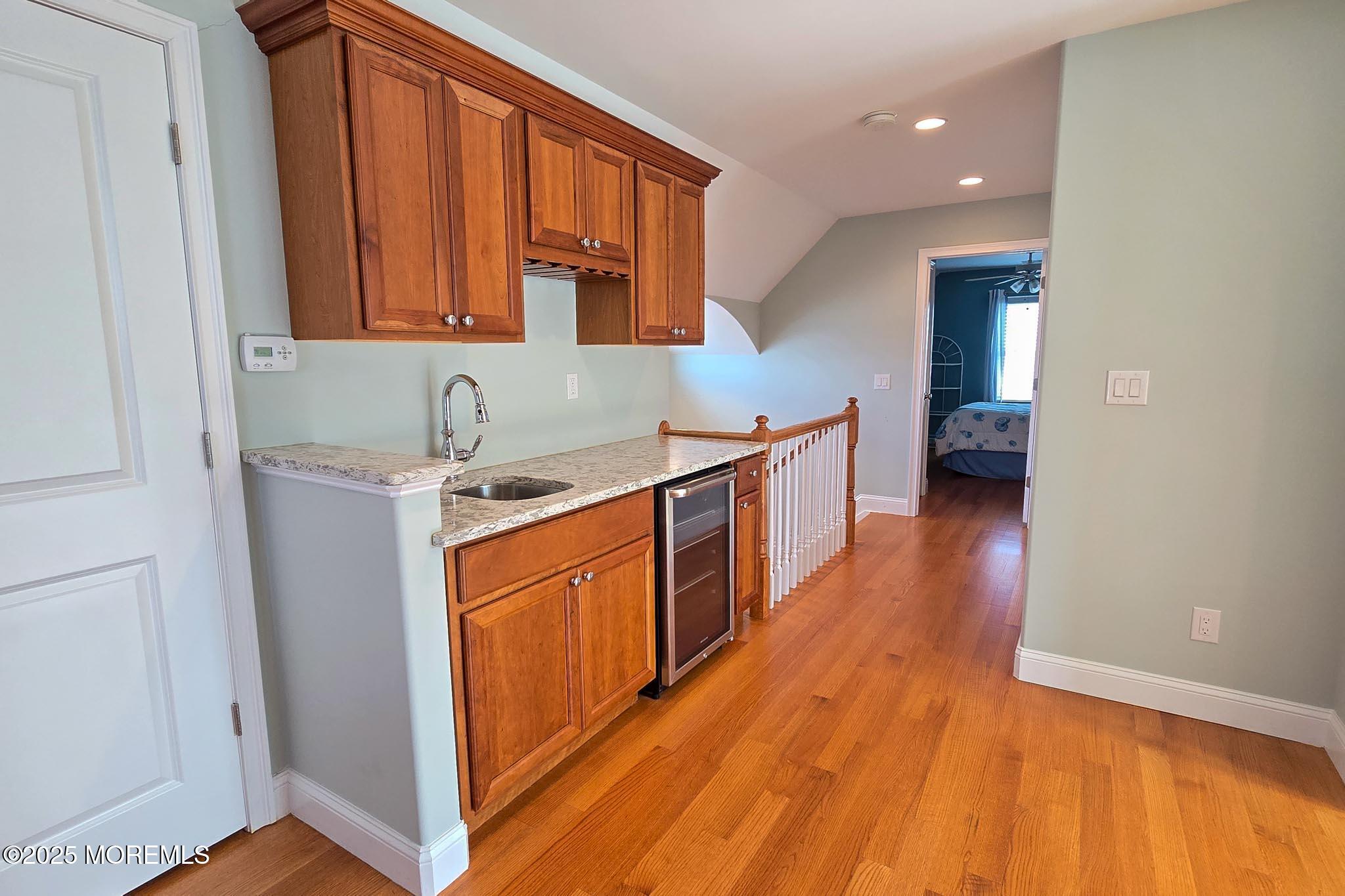 417 Delray Drive Lavallette, NJ 08735 - Photo 25 of 71 a kitchen with stainless steel appliances granite countertop a sink stove and cabinets