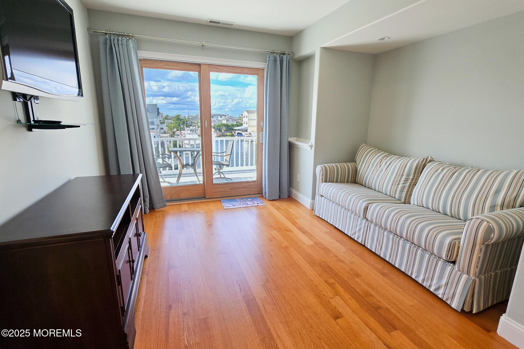 417 Delray Drive Lavallette, NJ 08735 - Photo 28 of 71 a living room with furniture and a large window