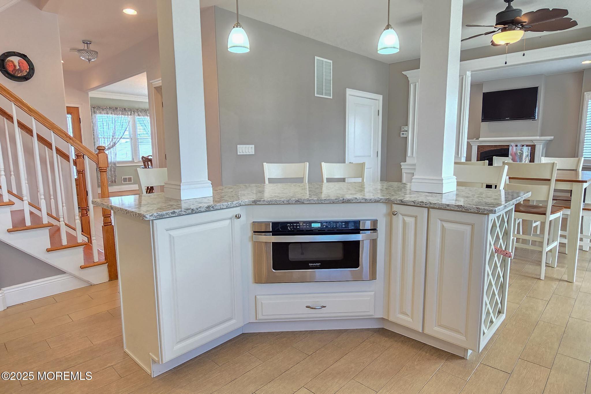 417 Delray Drive Lavallette, NJ 08735 - Photo 34 of 71 a large kitchen with granite countertop a stove and a sink