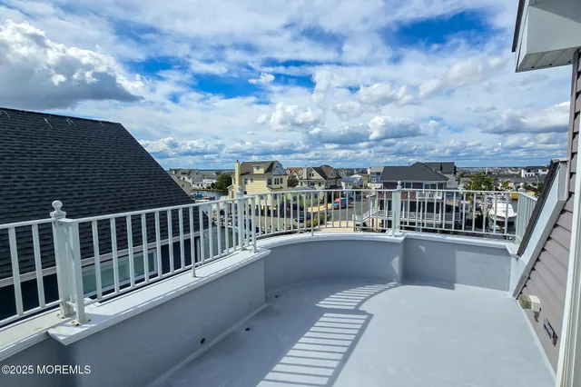 a living room with furniture a flat screen tv and a window