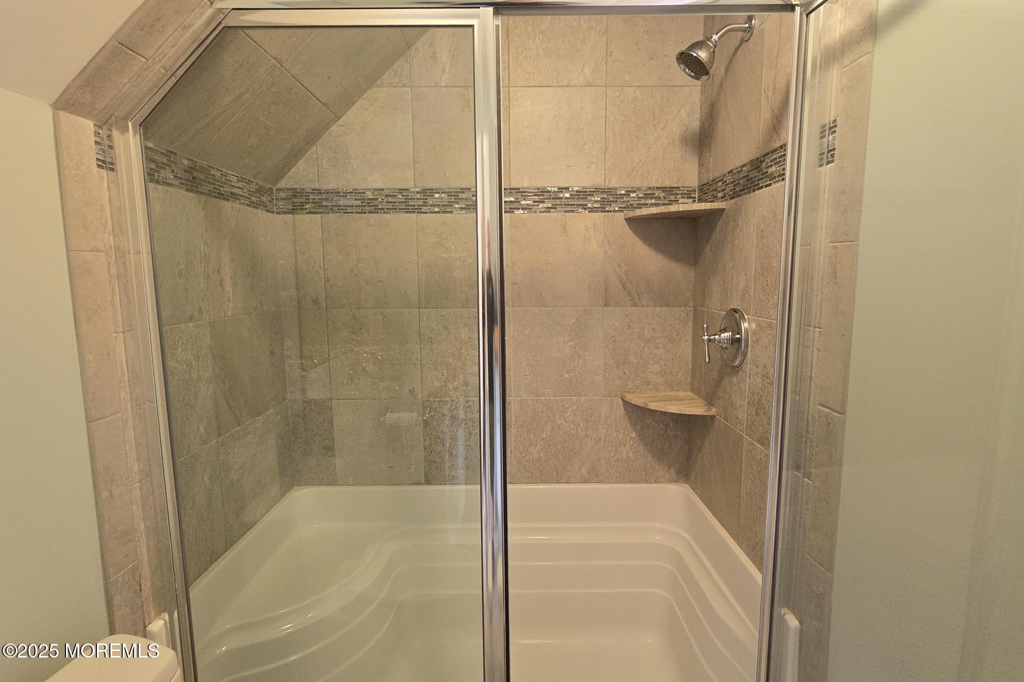 417 Delray Drive Lavallette, NJ 08735 - Photo 52 of 71 a bathroom with a glass shower door