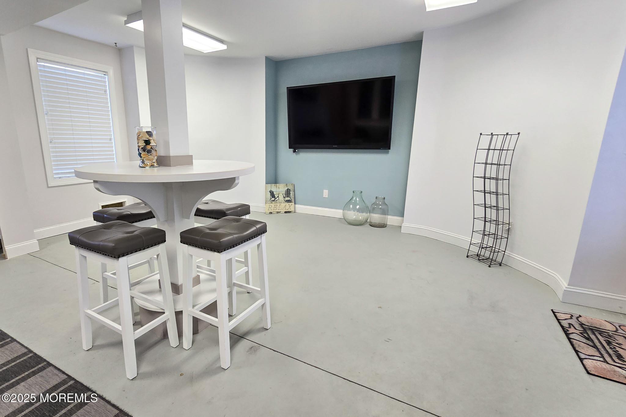 417 Delray Drive Lavallette, NJ 08735 - Photo 56 of 71 a living room with furniture a flat screen tv and a window