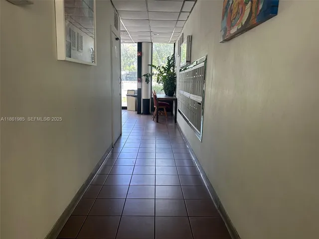 a kitchen with a sink and a refrigerator