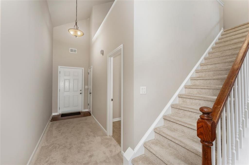 113 Tyson Woods Road Acworth, GA 30102 - Photo 4 of 37 a view of a hallway with wooden floor and entryway