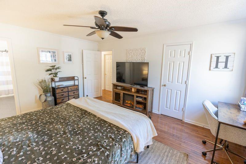 5028 Bird Road Gainesville, GA 30506 - Photo 15 of 34 a bedroom with a bed and a flat screen tv