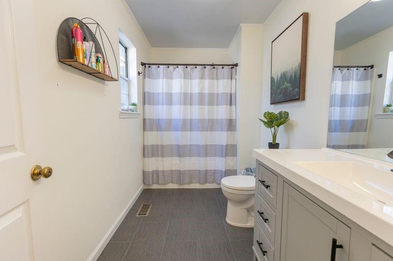 5028 Bird Road Gainesville, GA 30506 - Photo 17 of 34 a bathroom with a sink toilet and shower