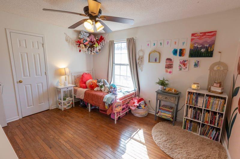 5028 Bird Road Gainesville, GA 30506 - Photo 20 of 34 a bedroom with furniture and a book shelf