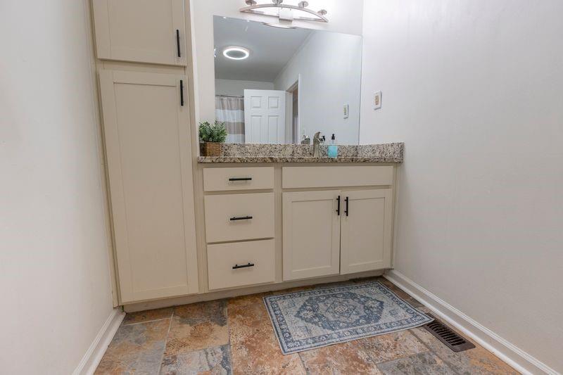 5028 Bird Road Gainesville, GA 30506 - Photo 23 of 34 a bathroom with a sink and a mirror
