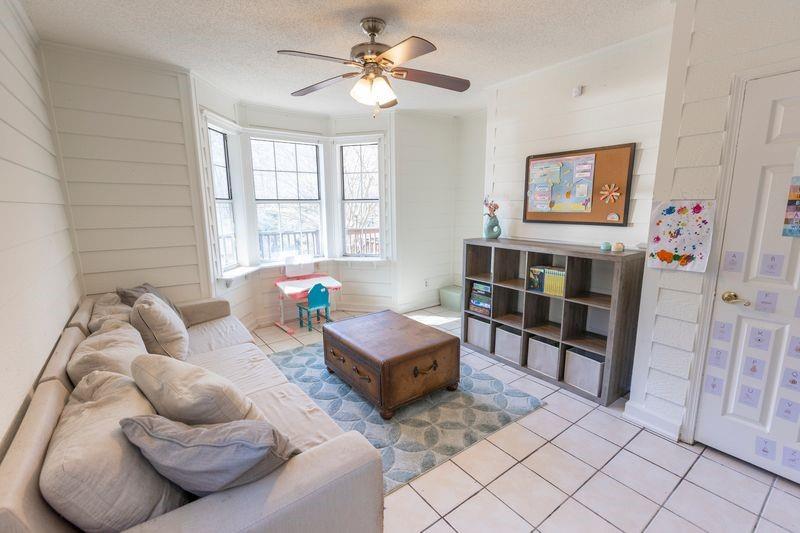 5028 Bird Road Gainesville, GA 30506 - Photo 25 of 34 a living room with furniture and a window