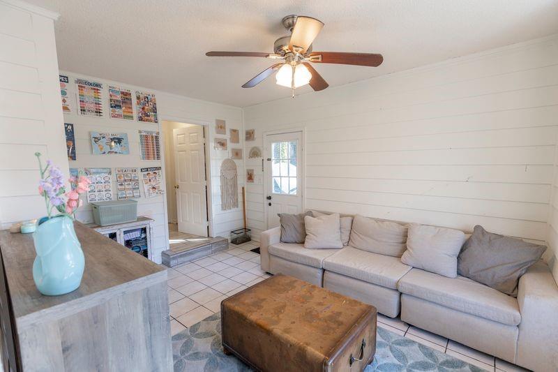 5028 Bird Road Gainesville, GA 30506 - Photo 26 of 34 a living room with furniture and a chandelier