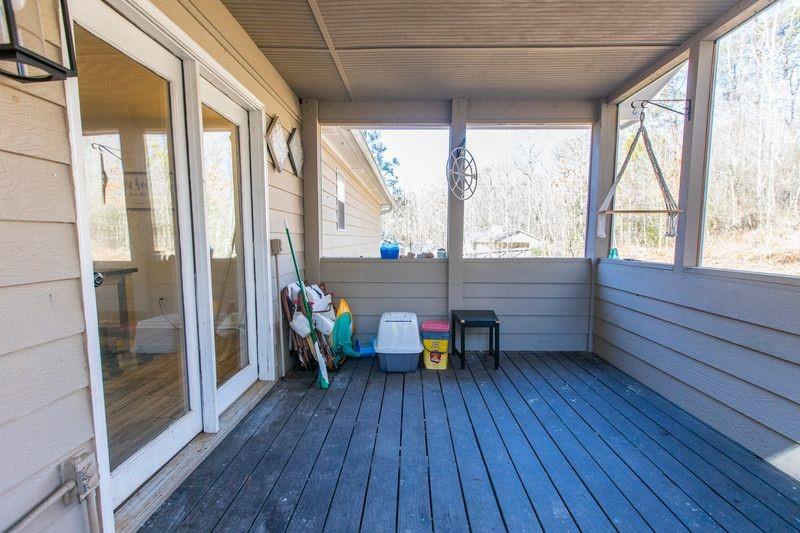 5028 Bird Road Gainesville, GA 30506 - Photo 28 of 34 a view of a large room with wooden floor and furniture
