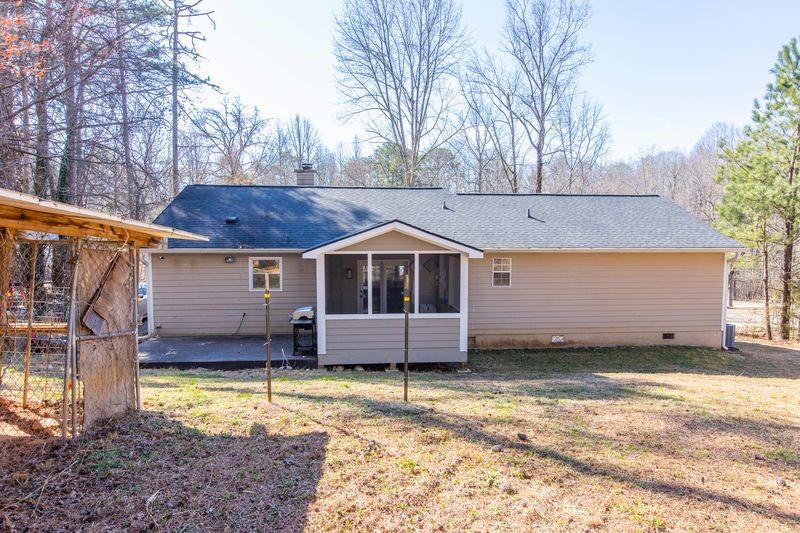 5028 Bird Road Gainesville, GA 30506 - Photo 29 of 34 a front view of a house with a yard and garage