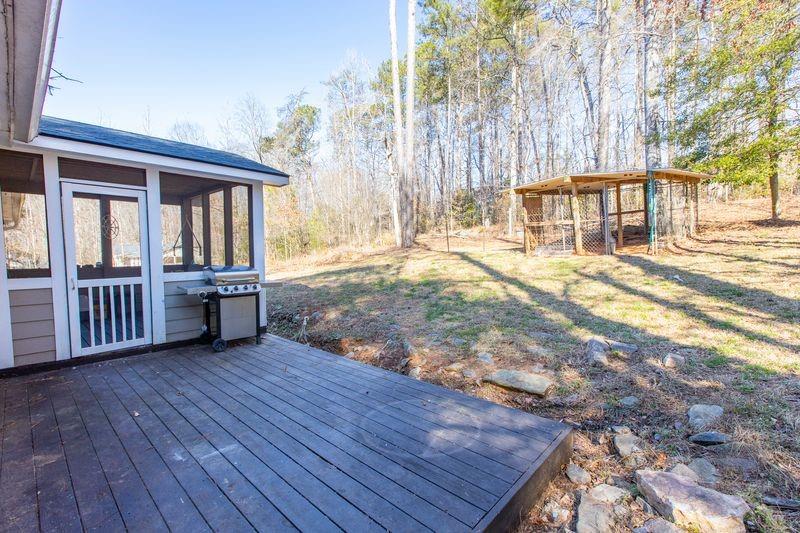 5028 Bird Road Gainesville, GA 30506 - Photo 34 of 34 a view of an house with backyard and deck