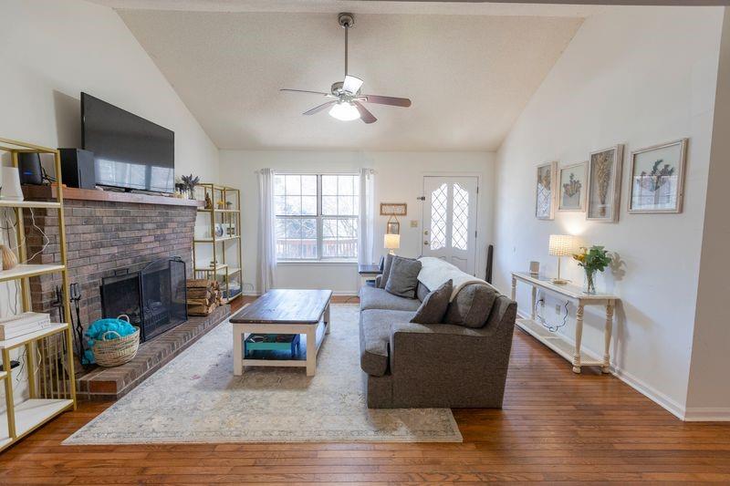 5028 Bird Road Gainesville, GA 30506 - Photo 7 of 34 a living room with furniture and a fireplace
