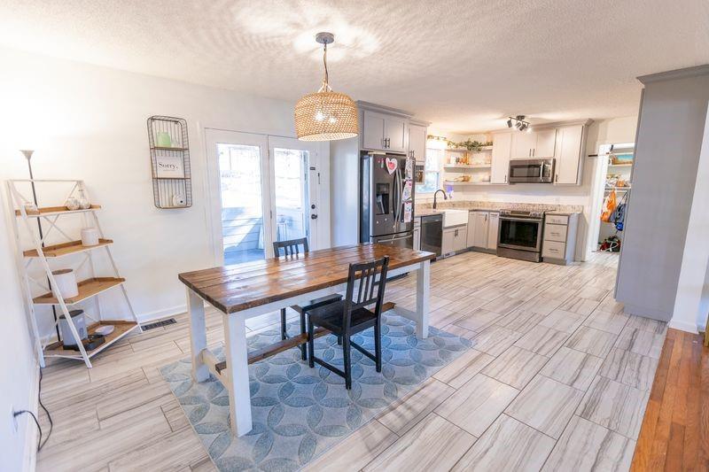 5028 Bird Road Gainesville, GA 30506 - Photo 9 of 34 a view of a livingroom with furniture and a fireplace